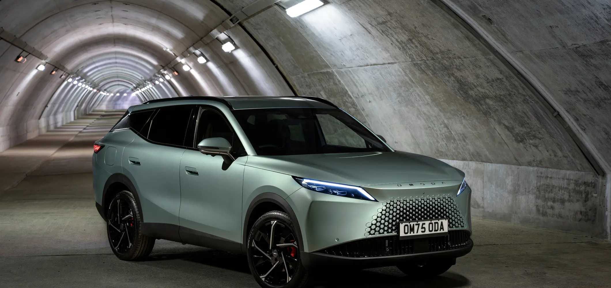 Close up of OMODA 7 in a lit tunnel