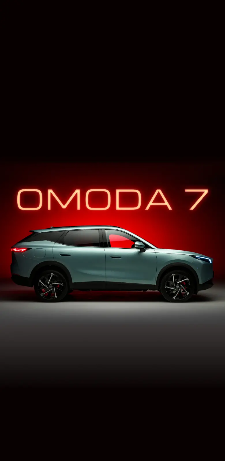 OMODA 7 parked in front of OMODA 7 sign in Orange